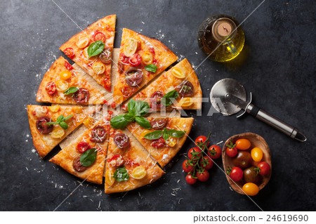 Pizza with tomatoes, mozzarella and basil Pizza with tomatoes, mozzarella and basil 24619690