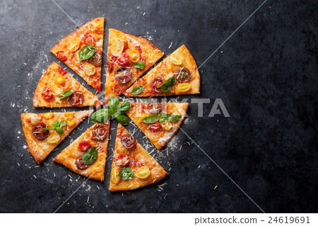 Pizza with tomatoes, mozzarella and basil Pizza with tomatoes, mozzarella and basil 24619691