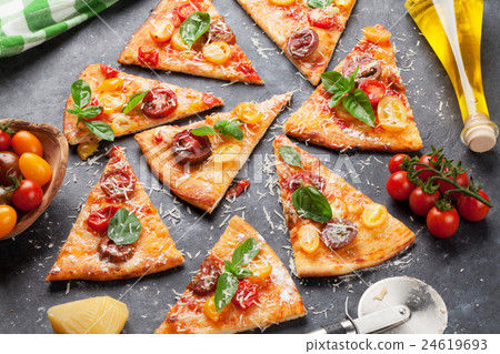 Pizza with tomatoes, mozzarella and basil Pizza with tomatoes, mozzarella and basil 24619693
