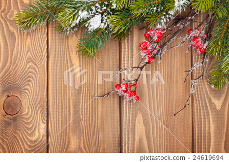 Christmas wooden background with snow fir tree Christmas wooden background with snow fir tree 24619694