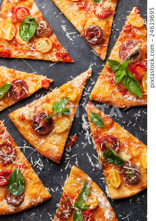 Pizza with tomatoes, mozzarella and basil 24619695