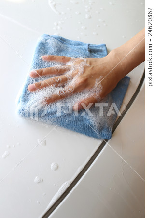 Women Hand in Wash a car with Microfiber Cloth. Women Hand in Wash a car with Microfiber Cloth. 24620862