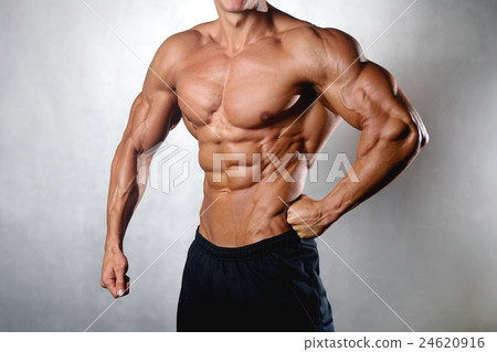 athletic man fitness model showing six pack abs 24620916