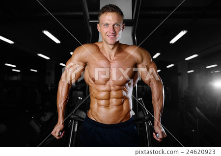 athletic man fitness model showing six pack abs athletic man fitness model showing six pack abs 24620923
