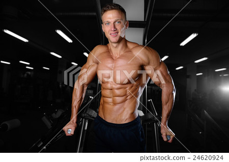 athletic man fitness model showing six pack abs athletic man fitness model showing six pack abs 24620924