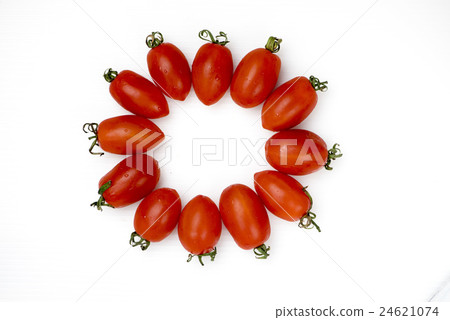 Virgin tomato arranged in the shape of a flower on a white background 24621074