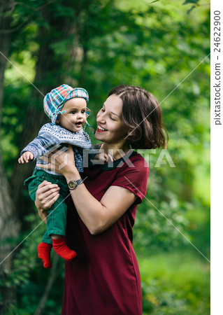 young family with a child on the nature 24622900
