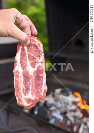 Juicy raw steak on barbecue background outdoor Juicy raw steak on barbecue background outdoor 24625115