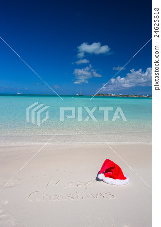 Merry Christmas written on tropical beach white 24625818