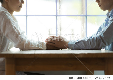 A couple holding hands 24627876