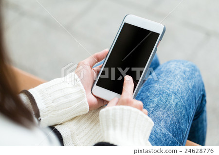 Woman touch on the screen of mobile phone Woman touch on the screen of mobile phone 24628776
