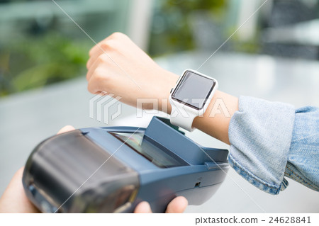 Customer using smart watch to pay 24628841