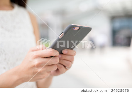 Woman using mobile phone 24628976