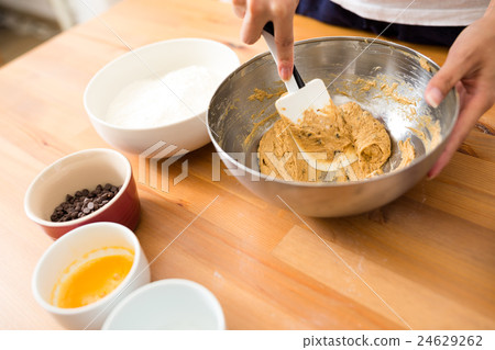 Mixing paste in bowl for making cookies Mixing paste in bowl for making cookies 24629262