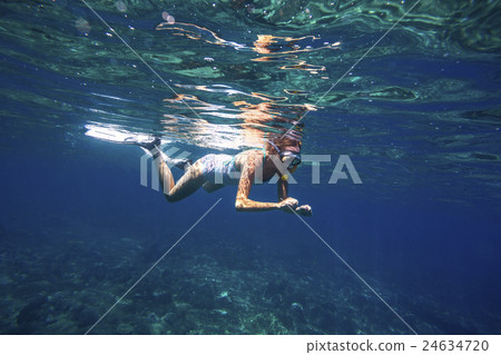 Young women is snorkeling 24634720