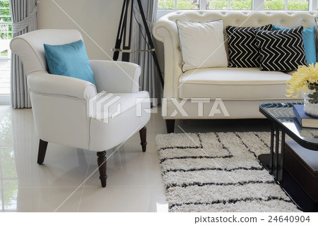 blue pillow on a white couch in living room blue pillow on a white couch in living room 24640904