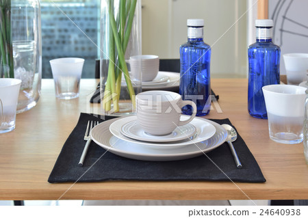 elegant table set in modern style dining room 24640938