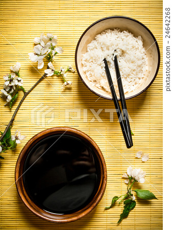 Boiled rice with soy sauce and the cherry branches Boiled rice with soy sauce and the cherry branches 24642268