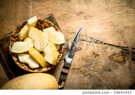 Sliced melon on a plate. 24642441