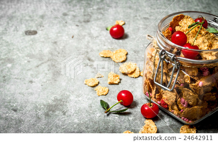 Healthy Breakfast. Muesli with cherries in a jar . 24642911