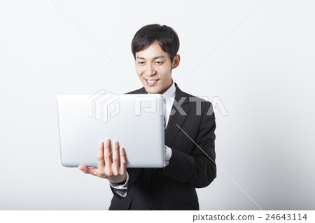 Businessman using a laptop Businessman using a laptop 24643114