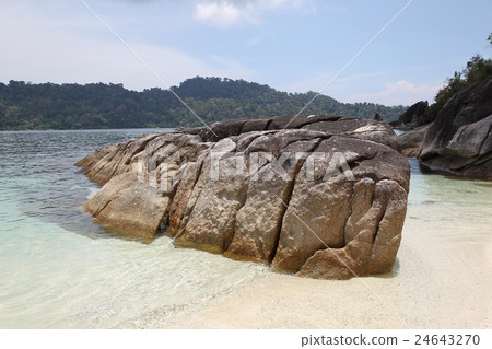 Large boulders on the beach 24643270