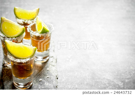 Tequila shots with lime and salt . Tequila shots with lime and salt . 24643732