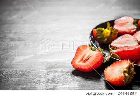 Halves of strawberry in the old plate. Halves of strawberry in the old plate. 24643897