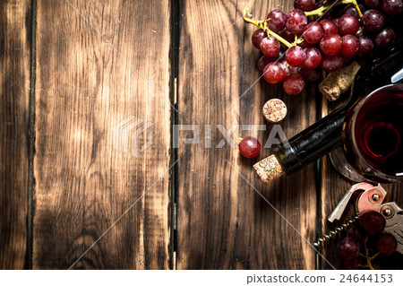 Red wine with grapes 24644153