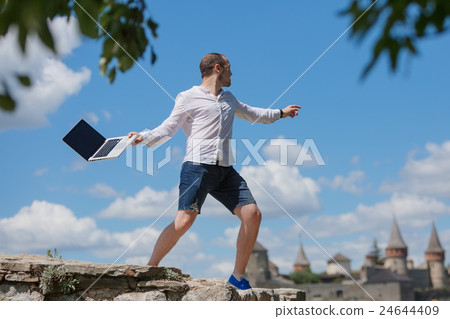 young man throws a laptop 24644409