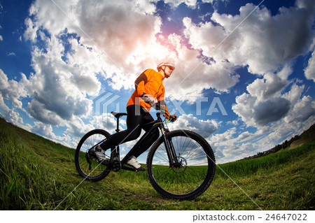 Cyclist in red sport equipment and helmet 24647022