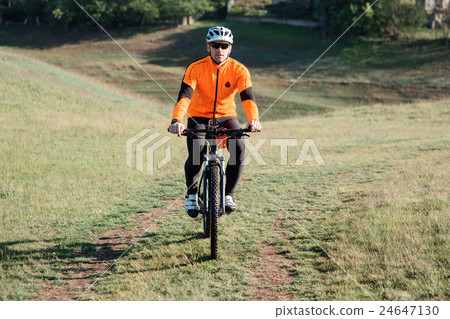 Young man traveler riding on bicycle with red 24647130