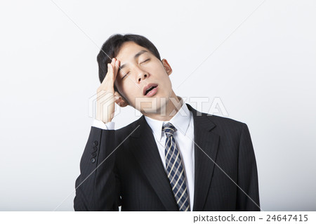 Businessman holding his head Businessman holding his head 24647415