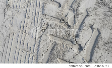 Prints of wheels and footprints 24648947