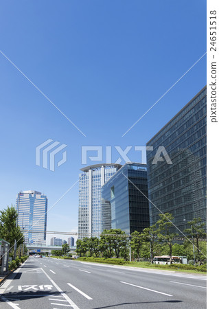 Tokyo city landscape Toyosu redevelopment district Rinkai subcenter heart clear blue sky skyscraper main street trees green 24651518