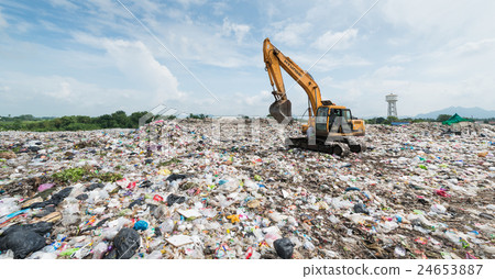 Backhoe car working in the sanitary landfill Backhoe car working in the sanitary landfill 24653887