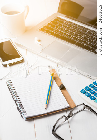 Blank notebook with smartphone and laptop 24653915