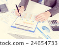 Businessman analyzing report on chart 24654733