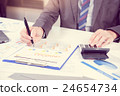 Businessman analyzing report on chart 24654734