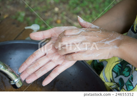 Washing of hands with soap under running water Washing of hands with soap under running water 24655352