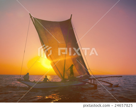 Fishermen on a Catamaran at Sunset Concept Fishermen on a Catamaran at Sunset Concept 24657825