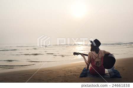 Guitar Playing Girl Beach Relaxation Song Music Concept Guitar Playing Girl Beach Relaxation Song Music Concept 24661838