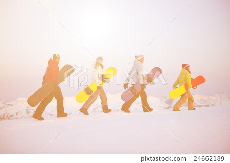 Group of snowboarders on top of the mountain 24662189