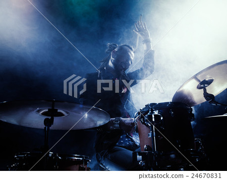 Silhouette of the drummer on stage. Silhouette of the drummer on stage. 24670831