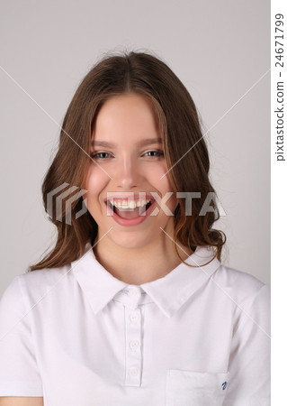 Smiling model in T-shirt. Close up. White Smiling model in T-shirt. Close up. White 24671799