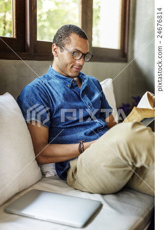 Attractive Young Man Reading Concept 24676814