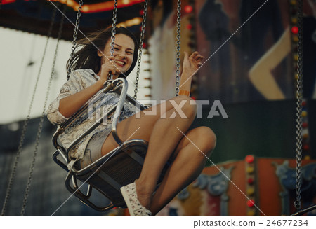 Woman Carnival Ride Riding Happiness Fun Concept Woman Carnival Ride Riding Happiness Fun Concept 24677234