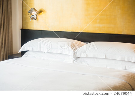 White pillow on bed 24679044