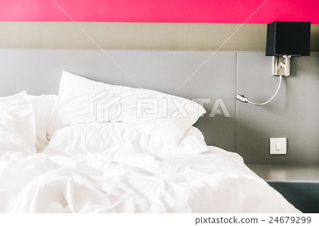 White pillow on bed 24679299