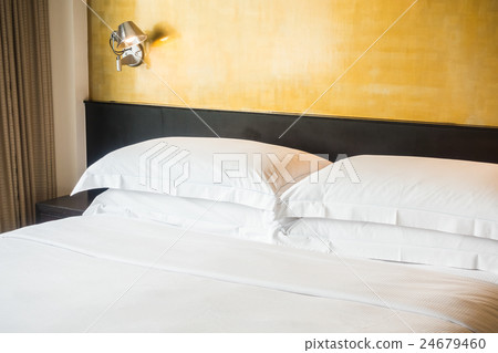 White pillow on bed White pillow on bed 24679460